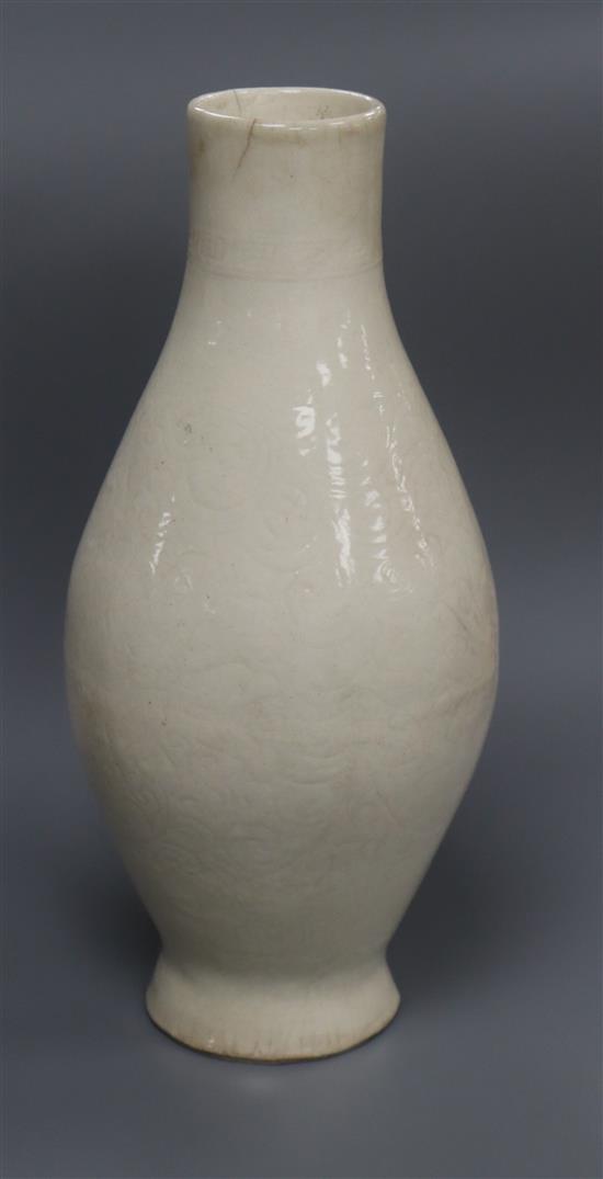 A 17th century Chinese southern whiteware vase with incised lotus design